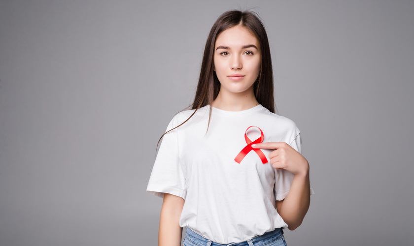 red-ribbon-breast-cancer-woman-isolated-gray-wall